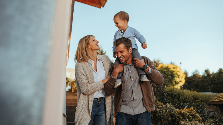A family arriving at their new home